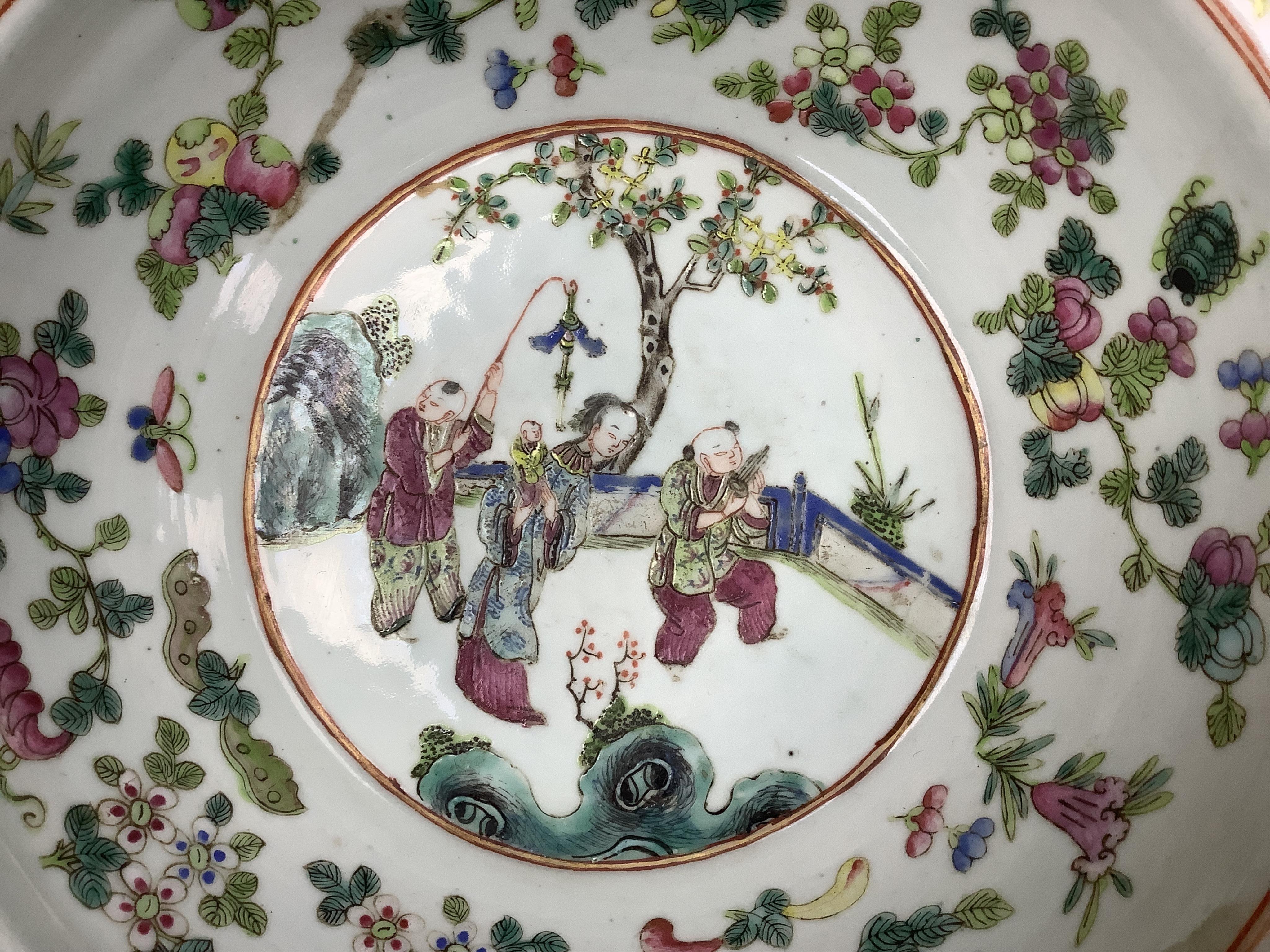 A 19th century Chinese famille rose basin, with wax seal to base., 30cm diameter x 10cm high. Condition - some wear to decoration.